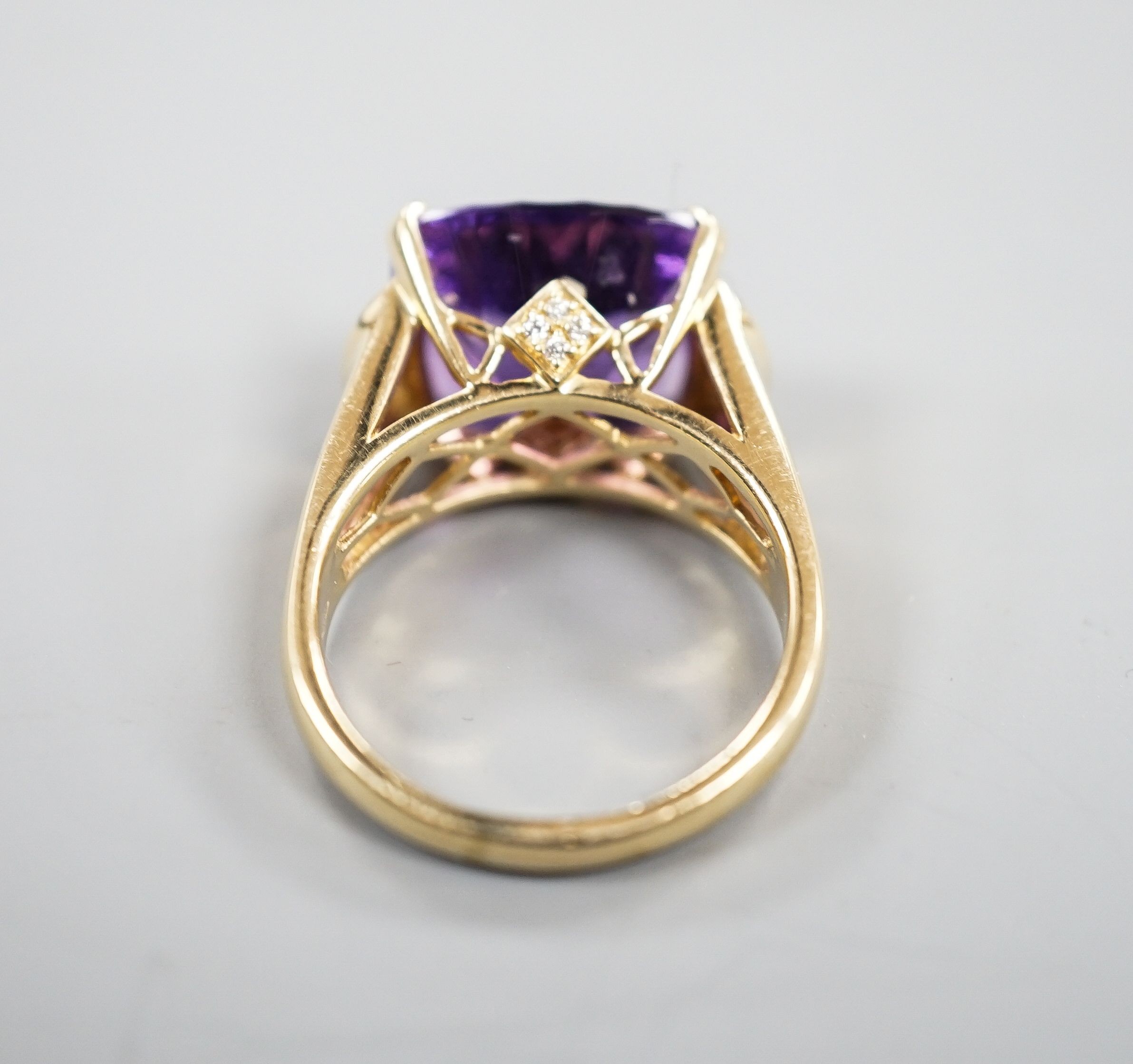 A modern 14k yellow metal, fancy cut amethyst and diamond chip set dress ring, size P/Q, gross weight 8 grams.